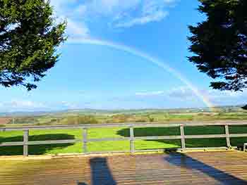 Beautiful rainbow photographed over Gentian Hill