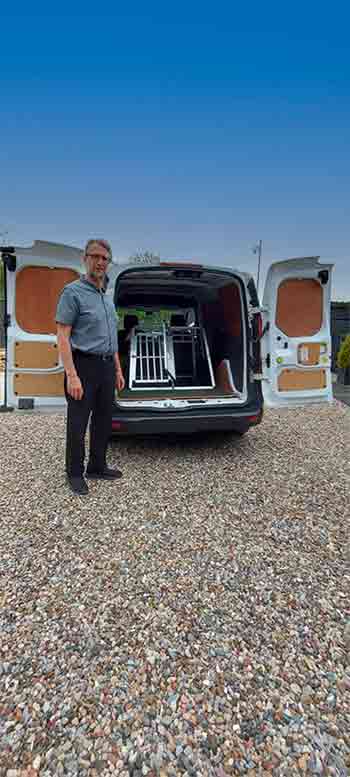 Jerry showing the Pet Taxi with back doors open and safety travel crate inside